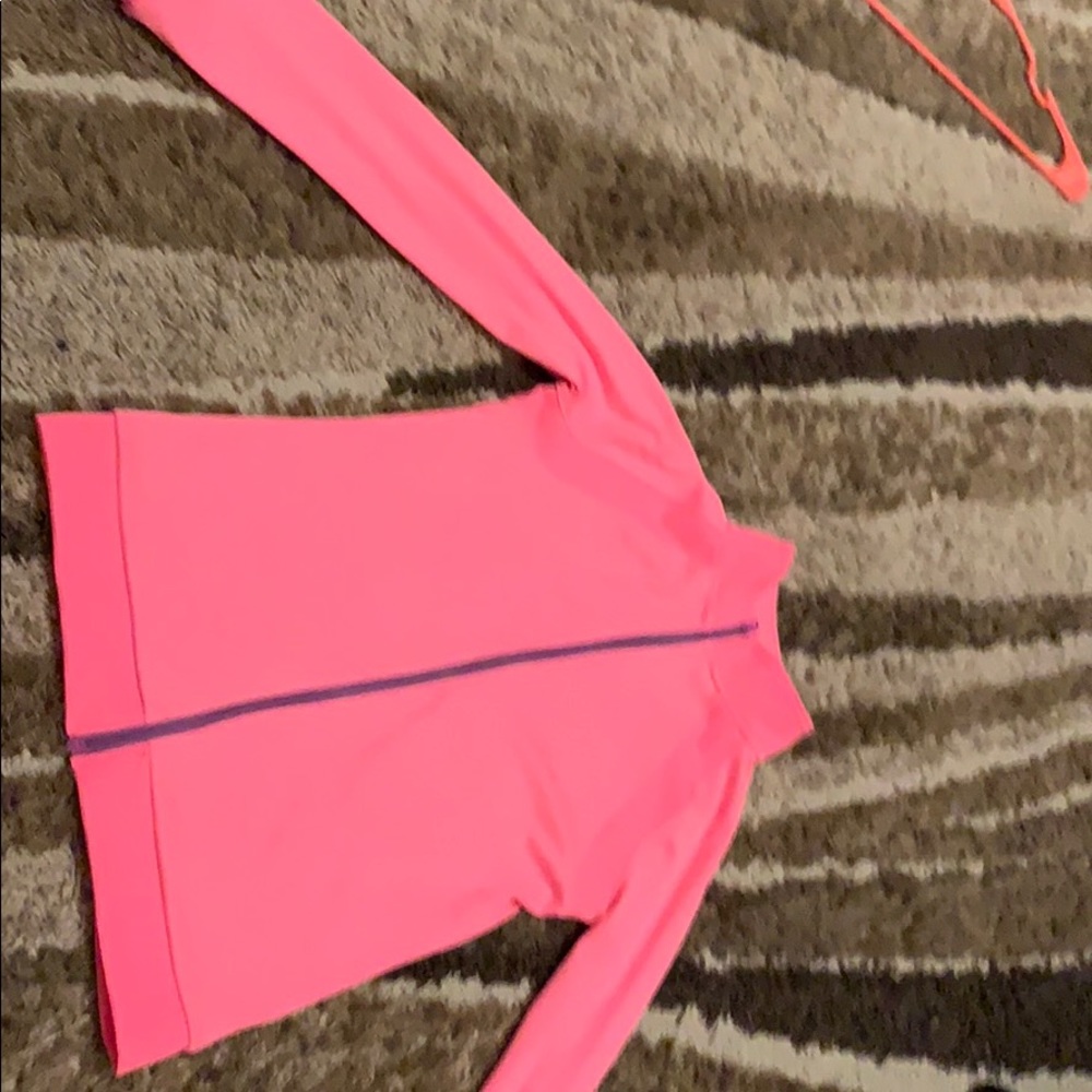 A bright pink sweater